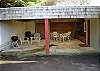 Covered Carport with BBQ + Lawn Furniture