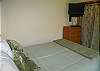 Queen size comfort and wall-mounted flat screen.