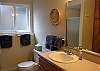 Downstairs bathroom with shower reflected in mirror