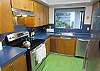 Bright kitchen with new stainless steel appliances at Beach House at NeahKahNie