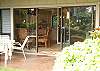 Look back inside to the dining area with kitchen behind.