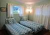 Twin bedroom on main floor. Stairs from this room to lower level bed/bath.