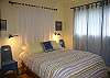 Cozy master bedroom with queen bed.