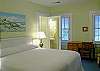 Bedroom with 1 king bed, TV, and private bathroom.