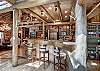 View from the island bar into the spacious kitchen and dining area - Bear Lodge Breckenridge Vacation Rental 