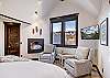 The small seating area in the upper level master bedroom is the perfect place to warm by the fire. -  The Bogart House Breckenridge Vacation Rental 