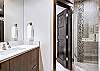 Hallway bathroom utilized by the bunk room with walk-in shower. -  The Bogart House Breckenridge Vacation Rental 