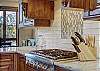 Updated oven with new backsplash and hooded range - Breck Escape Breckenridge Vacation Rental  