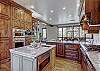 Spacious kitchen with island and stainless steel appliances - Breck Escape Breckenridge Vacation Rental  