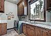Laundry room, located on the bottom floor with full size washer/dryer and sink - Breck Escape Breckenridge Vacation Rental  