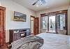 Relax after a long day in this cozy king bed and watch some of your favorite shows - Breck Escape Breckenridge Vacation Rental  
