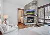 Get some much needed privacy in this master bedroom with flat screen TV and private bathroom - Breck Escape Breckenridge Vacation Rental  
