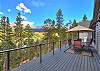Upper patio area with umbrella seating - Breck Escape Breckenridge Vacation Rental   