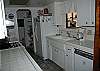 Propane burners, double sink, dishwasher, trash compactor, microwave and everything you will need.