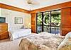 The second bedroom with a king bed and extra daybed