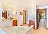 The master bathroom and hallway to guest bedroom