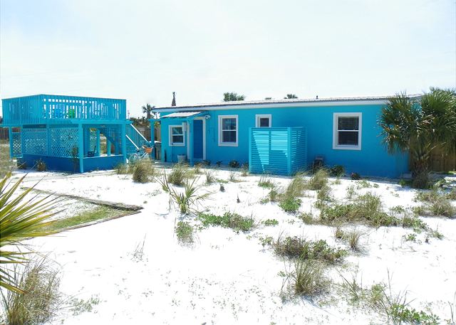 This updated cottage has lots of outdoor space and is located just a short walk from the beach.