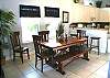 Dining table seats up to 7, 3 seats at the breakfast bar