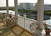 Spacious back deck overlooks a nature pond to enjoy the gulf breezes from