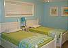 Twin beds in second bedroom