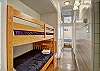 Twin bunk beds in hallway