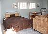 Suite  queen bed with private bath, flat screen T.V. and sectional couch.
