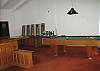 Entertainment Room with Full Sized Pool Table, Bar, Seating, and Darts