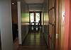 Hallway down to Dining Room & Kitchen with Hardwood Floors