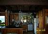Kitchen just opened up and renovated with new counters, floor, lighting, and breakfast bar.  Ocean and garden views abound...