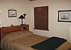 2nd bedroom with full bed and sleeping loft and tv