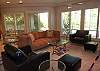 The open and spacious great room with finishing touches.This room is adjacent to the kitchen and opens to the backyard pool and patio areas.