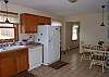 Kitchen with table and seating for four.