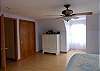 Bedroom on upper level with king bed.