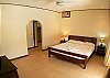 Master Bedroom with King bed, walk-in closet and ensuite bathroom with shower at VillaLas Monas vacation rental house near Jaco, Costa Rica