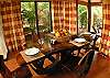 Rustic hardwood dining table for four  at La Flor Rustico beachfront vacation rental in Jaco, Costa Rica