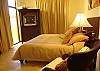 Master Bedroom with King Bed, walk-in closet, TV with DVD and cable, ensuite bathroom with shower, at Casa La Ostra vacation rental house in the exclusive Hermosa Palms beachfront gated community, Playa Hermosa, Costa Rica