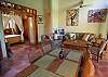 The dining room has a table for 6 and is in between the kitchen and the beautiful decorated living room, wich has a TV and AC and acces to the terrace, garden and pool, at Sonidos del Rio, Vacation Rental, Jaco Costa. Rica.