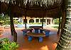 Palm thatch Gazebo with table and light, ideal to enjoy together with charcoal grill, at Casa de Somers, vacation rental villa in Esterillos near Manuel Antonio