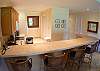 Kitchen and breakfast bar with seating for 4 at Del Mar 5N vacation rental condo at Los Suenos Resort & Marina, Playa Herradura, Costa Rica