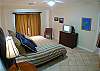 Master Bedroom with King bed, TV, black-out curtains, large closet and ensuite bathroom, at Del Mar 5N vacation rental condo at Los Suenos Resort & Marina, Playa Herradura, Costa Rica
