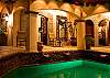 Pool and courtyard by night at Villa Antigua luxury vacation rental home in south Jaco beach, Costa Rica