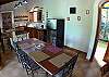 Kitchen and dining table at Quinta Teca vacation rental house at Opera Salvaje Playa Hermosa de Jaco