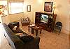 Living area with Queen size sofabed and TV/DVD, at our Mar Arena beachfront vacation rental condo in Jaco, Costa Rica