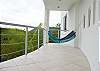 Hammock hanging on terrace at Casa Infinito luxury vacation rental home at Valle Perdido in Playa Hermosa, Costa Rica