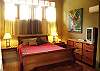 This is the Measter Bedroom with a King bed, TV, DVD player, AC, closet and bathroom at Sonidos del Mar, Vacation Rental, Jaco Costa Rica.