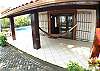Hammock on front porch of Casa Mandolina beachfront vacation rental home in Jaco, Costa Rica