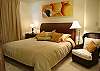 Master bedroom with King bed, walk-in closet, TV and DVD with cable and ensuite bathroom with shower, at Casa La Ostra vacation rental house in the exclusive Hermosa Palms beachfront gated community, Playa Hermosa, Costa Rica