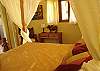This room has a beautiful Queen canopy bed and a closet at sonidos del Rio, Vacation Rental, Jaco Costa Rica.