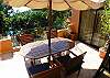 Terrace with table and chairs just outside the living room, at Casa Tortuga vacation rental house at Hermosa Palms in Playa Hermosa, Puntarenas, Costa Rica
