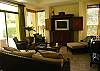 This is the beautiful decorated living room with TV, DVD, Stereo and access to the terrace and pool at Casa La Ostra vacation rental house in the exclusive Hermosa Palms beachfront gated community, Playa Hermosa, Costa Rica